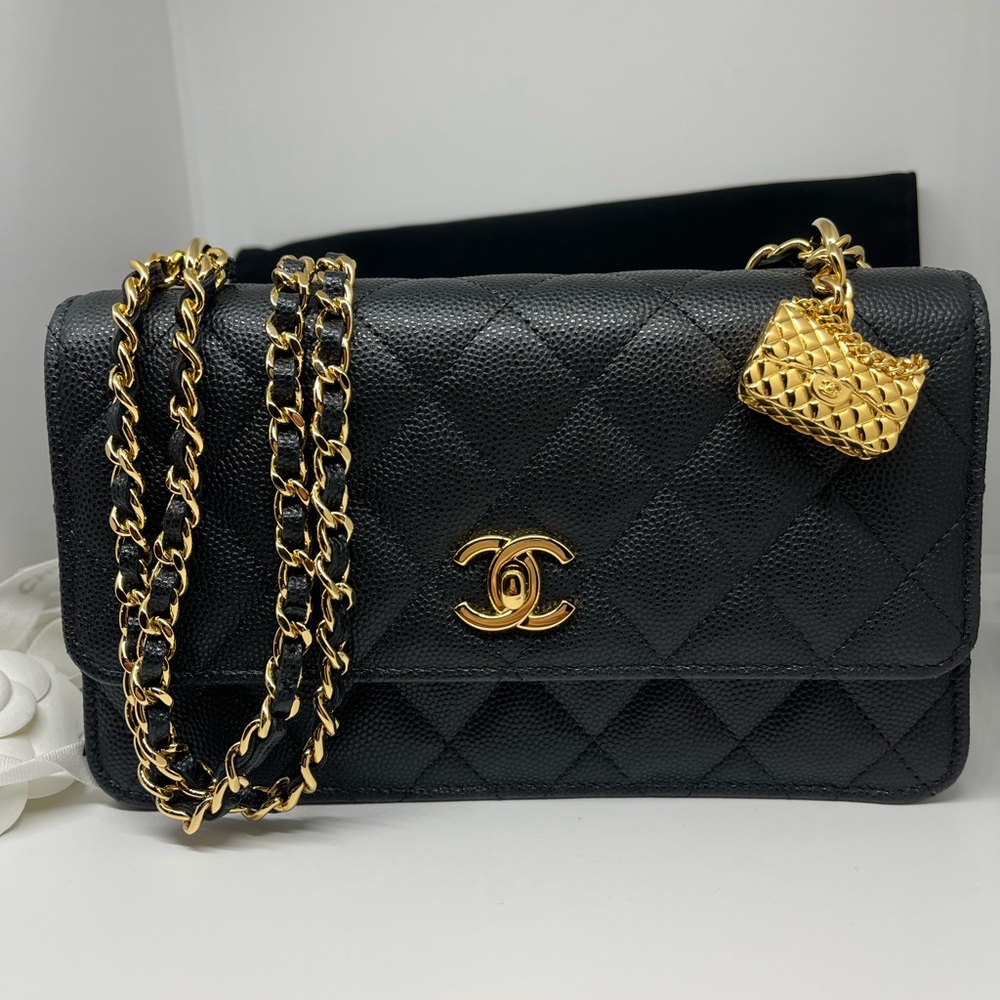 CHANEL Black Quilted Shoulder Bag with Gold Details